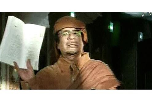 REFILE - REMOVING RESTRICTIONS Libya's leader Muammar Gaddafi displays the 