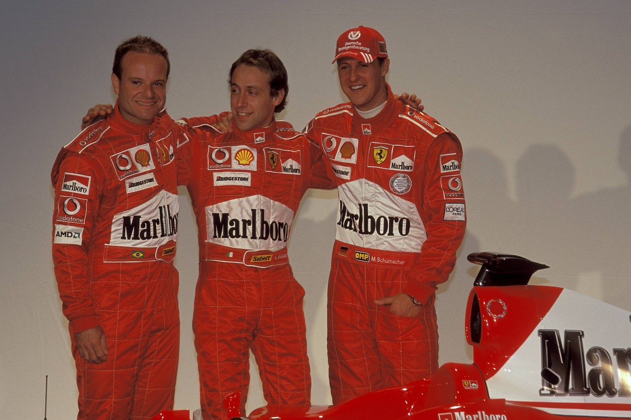 Michael Schumacher mit seinen Ex-Kollegen Luca Badoer und Rubens Barrichello (v.r.n.l.).