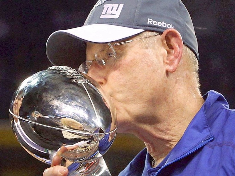 New York Giants head coach Tom Coughlin kisses the Vince Lombardi Trophy after the Giants defeated the New England Patriots in the NFL Super Bowl XLVI football game in Indianapolis, Indiana, February 5, 2012. REUTERS/Jeff Haynes (UNITED STATES  - Tags: SPORT FOOTBALL)