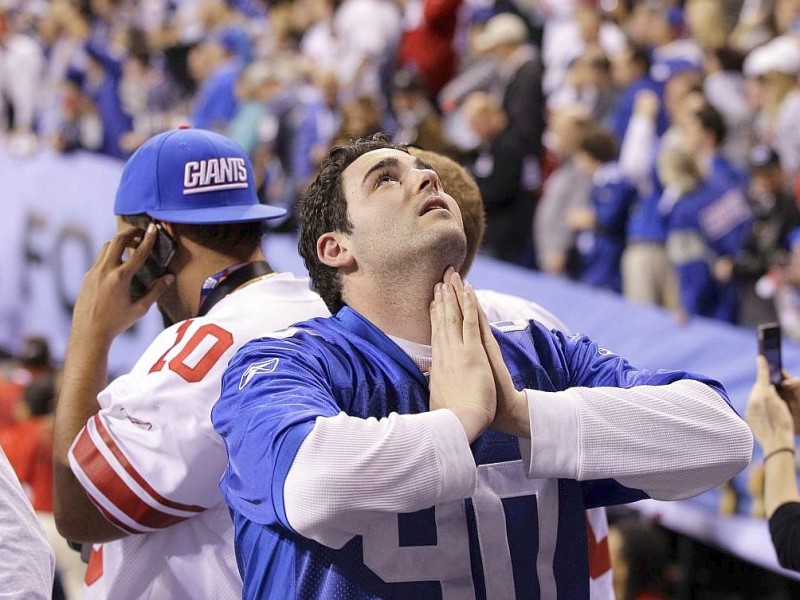 New York Giants fans celebrate after the NFL Super Bowl XLVI football game against the New England Patriots, Sunday, Feb. 5, 2012, in Indianapolis. The Giants won 21-17. (AP Photo/Elise Amendola)