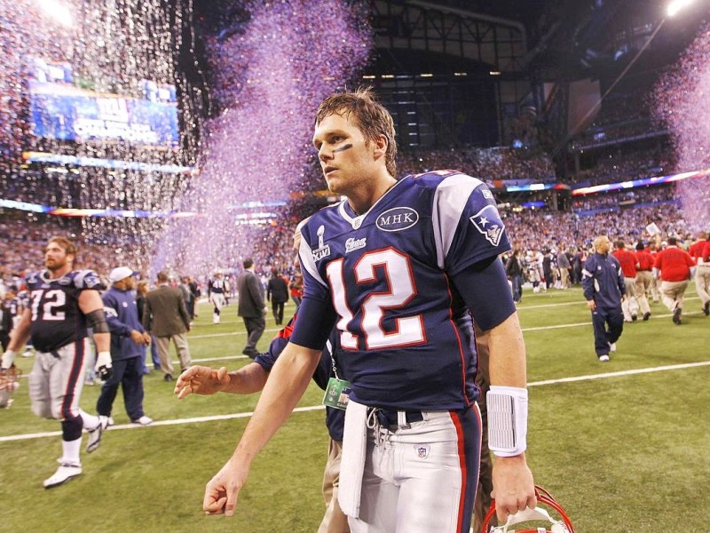 New England Patriots quarterback Tom Brady leaves the field after their loss to the New York Giants in the NFL Super Bowl XLVI football game in Indianapolis, Indiana, February 5, 2012.  REUTERS/Gary Hershorn (UNITED STATES  - Tags: SPORT FOOTBALL)