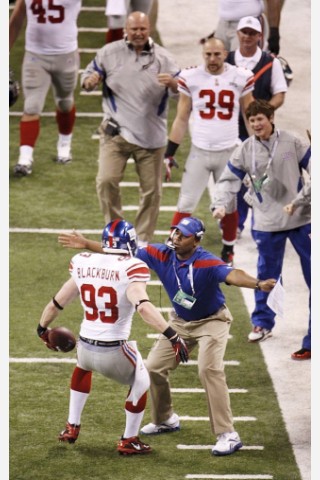 New York Giants middle linebacker Chase Blackburn celebrates after an interception in the fourth quarter during their NFL Super Bowl XLVI football game against the New England Patriots in Indianapolis, Indiana, February 5, 2012. REUTERS/Brent Smith (UNITED STATES  - Tags: SPORT FOOTBALL)