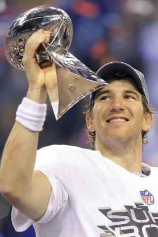 New York Giants quarterback Eli Manning holds up the Vince Lombardi Trophy after the Giants' 21-17 win in the NFL Super Bowl XLVI football game against the New England Patriots, Sunday, Feb. 5, 2012, in Indianapolis. (AP Photo/Chris O'Meara)