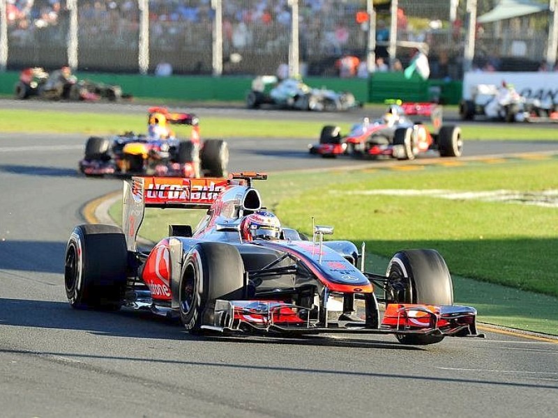 McLaren-Mercedes driver Jensen Button of Britain leads the field to win Formula One's Australian Grand Prix in Melbourne on March 18, 2012.  Button led throughout the opening race of the 2012 Formula One Grand Prix season on the 5.3km Albert Park road circuit.  AFP PHOTO/William WEST