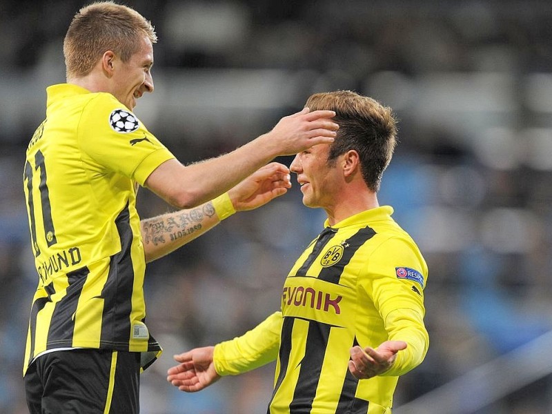 MADRID, SPAIN - NOVEMBER 06:  Mario Gotze (R) of of Borussia Dortmund celebrates with Marco Reus after scoring their team's second goal during the UEFA Champions League Group D match between Real Madrid and Borussia Dortmund at Estadio Santiago Bernabeu on November 6, 2012 in Madrid, Spain.  (Photo by Denis Doyle/Getty Images)