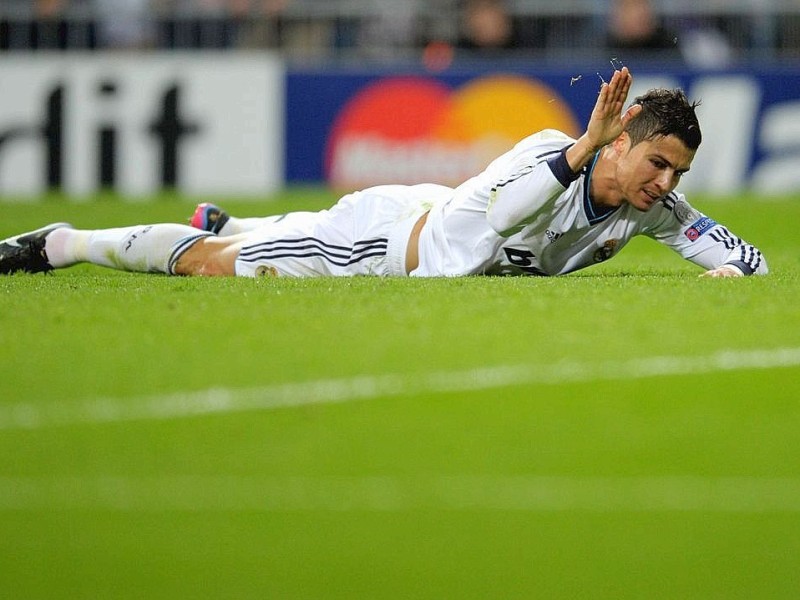 MADRID, SPAIN - NOVEMBER 06:  Christiano Ronaldo of Madrid reacts during the UEFA Champions League Group D match between Real Madrid and Borussia Dortmund at Estadio Santiago Bernabeu on November 6, 2012 in Madrid, Spain.  (Photo by Dennis Grombkowski/Bongarts/Getty Images)