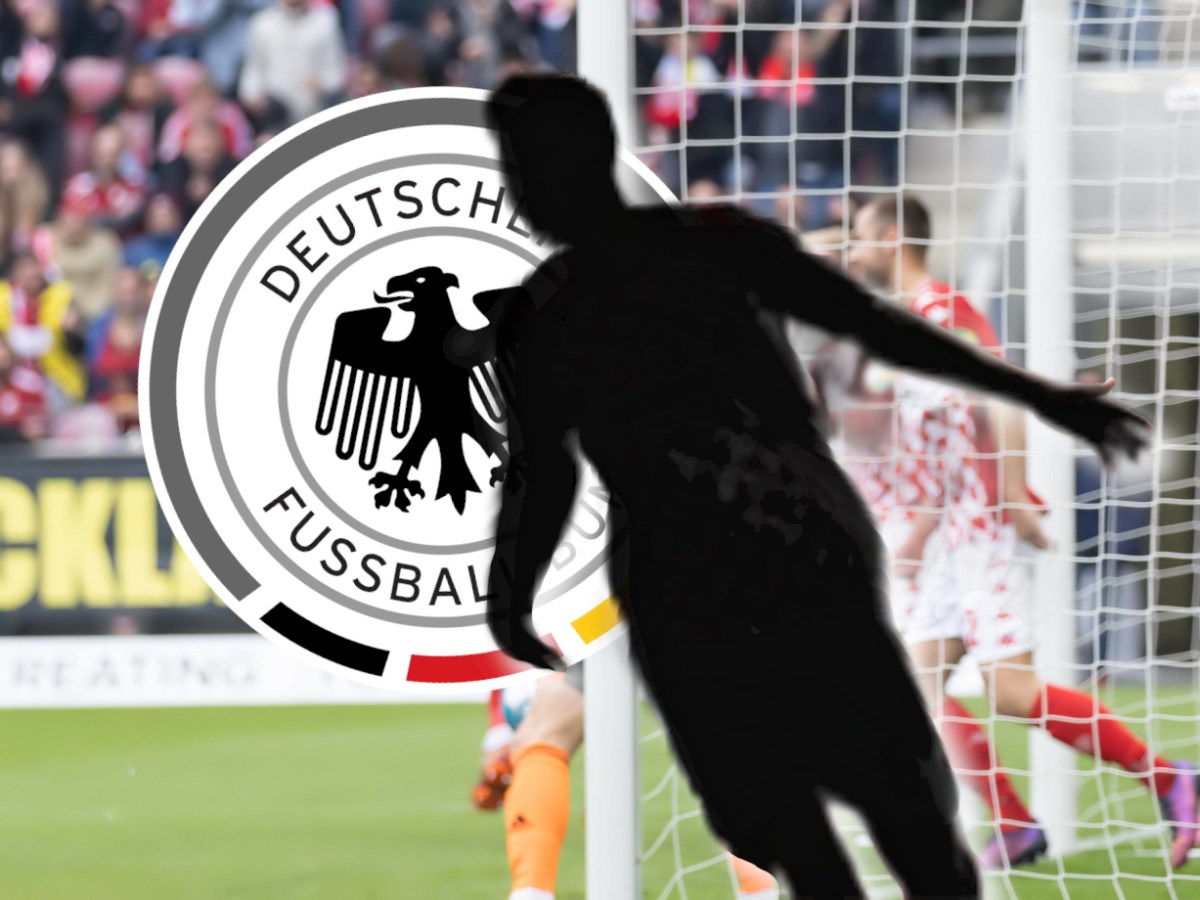 Anton Stach jubelt vor dem DFB-Logo.